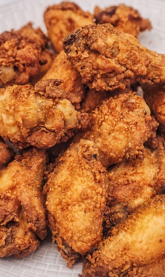 Pile of crispy bone-in breaded wings