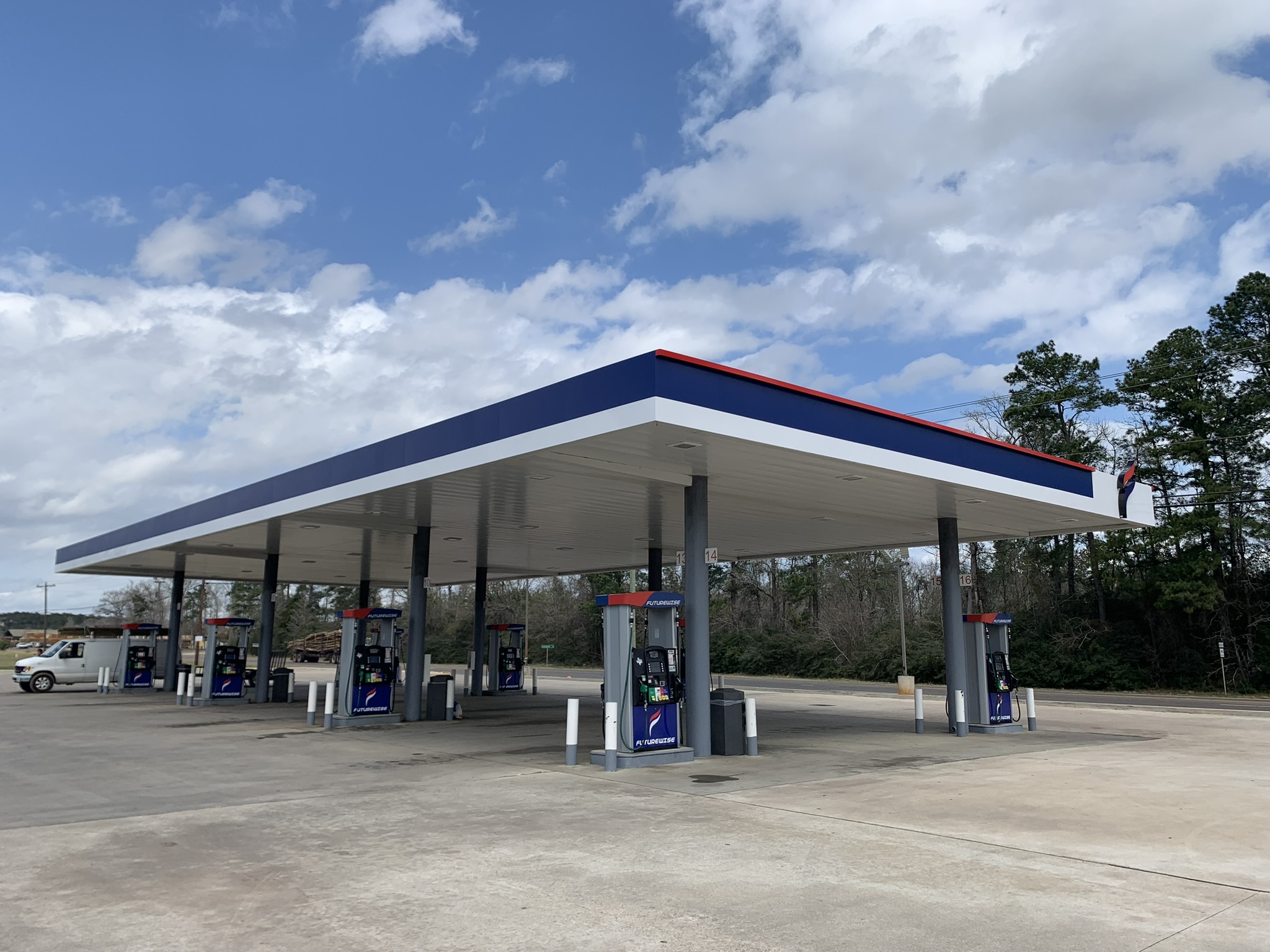 FUTUREWISE fuel pumps under the blue and red canopy